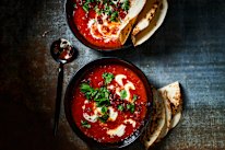 Creamy chipotle tomato soup with crispy chorizo and toasted seeds.