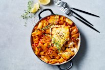 Tomato, harissa and chickpea pasta with charred hot honey feta.