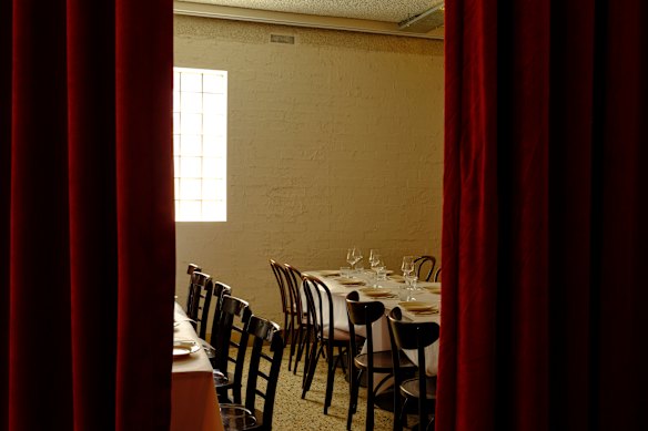 A curtained-off private dining room lies at the rear.