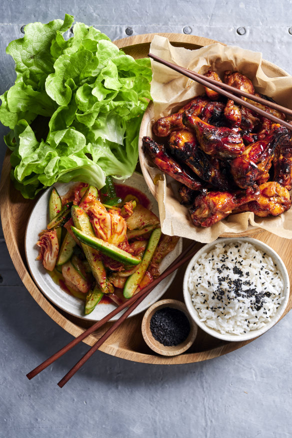 Sticky Korean chicken wings with kimchi-pickled cucumbers. 