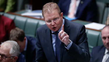 Workplace Minister Craig Laundy said it was "not unreasonable" for the commission to ask if it was in the best interests of the country to have several law-breaking unions consolidate their power.