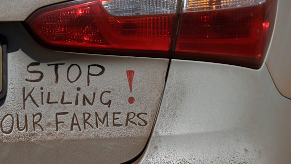 A bumper sign during a blockade of the freeway between Johannesburg and Vereeniging, in Midvaal, South Africa, last year in protest against the murder of farmers.