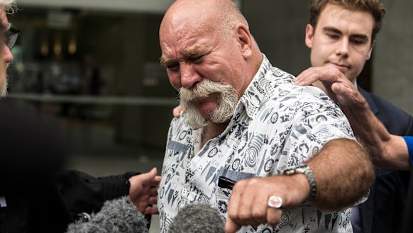 Peter Nixon displays his father's ring.