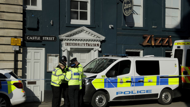 Police officers outside the  Zizzi restaurant in Salisbury, England, where traces of a nerve agent have been found. 