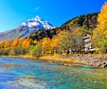 Autumn leaves and snow on Japan’s Mount Yakedake above the Azusa River.