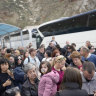 People wait for the ferry to arrive at Santorini on Monday.