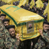 Hezbollah fighters carry the coffin of their comrade, senior commander Taleb Sami Abdullah, 55, known within Hezbollah as Hajj Abu Taleb, who was killed late Tuesday by an Israeli strike in south Lebanon.