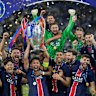 PSG players celebrate with the trophy after winning the Champions League final soccer match between Paris Saint-Germain and Inter Milan at the Allianz Arena in Munich, Germany, Saturday, May 31, 2025. (AP Photo/Matthias Schrader)