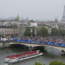 Slowly the boats made their way down the Seine.