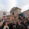 People take part in an Anti-ICE demonstration, ahead of the 2026 Winter Olympics, in Milan, Italy, Saturday, Jan. 31, 2026. 