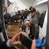 Palestinian patients board a vehicle in Khan Younis on their way to the Rafah crossing, as they leave the Gaza Strip for medical treatment abroad.