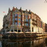 Board a classic wooden boat from the hotel’s riverside terrace for a private guided canal tour to the Van Gogh Museum.
