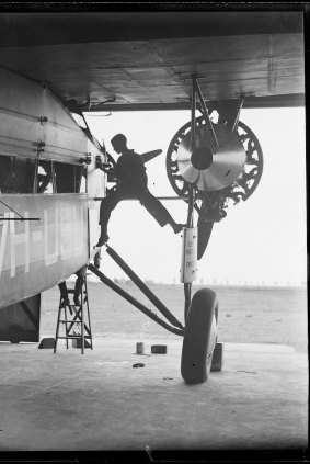 Technician working on Charles Kingsford Smith's Southern Cross aircraft, NSW, ca. 1931