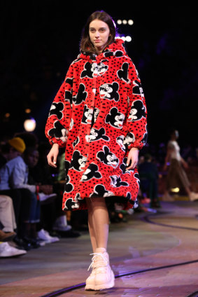 A model wears a creation for the Opening Ceremony Spring 2018 Collection presented at Disneyland.