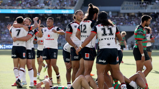 Right start: The Warriors celebrate a try as they build an unassailable lead against South Sydney.