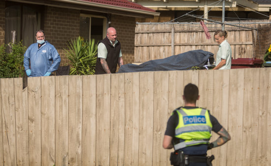 The woman's body is removed from the scene.