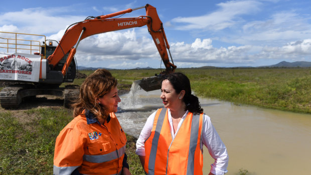 Queensland Premier Annastacia Palaszczuk (right) and Townsville Mayor Jenny Hill are seen at the site of a water pipeline project.