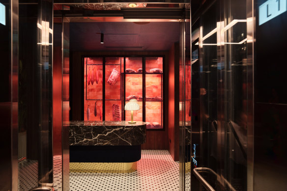 The dry-ageing space has an orange glow, thanks to a wall of rock-salt tiles. 