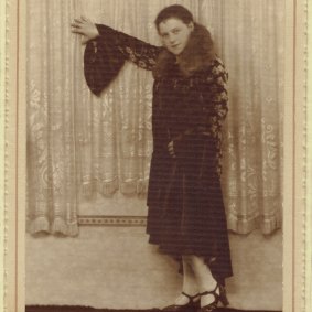 Esther Rudov models one of the Parisian dresses she brought back from her 1938 trip to Poland and Germany.  