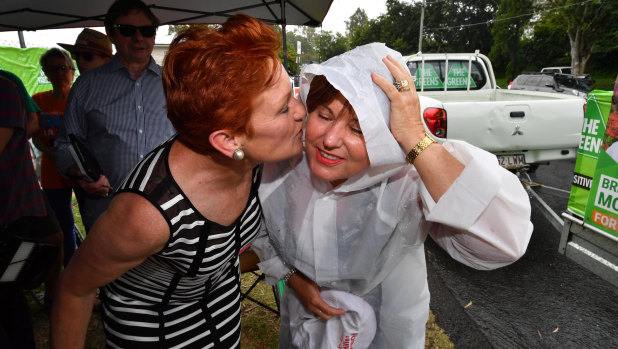 One Nation leader Senator Pauline Hanson (left) and ALP member for Bundamba, Jo-Ann Miller (right) are seen together in the suburb of Bundamba in Ipswich on Tuesday.
