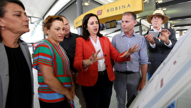 Premier Annastacia Palaszczuk discusses Labor's rail plans at Robina with Labor's candidate for Bonney Rowan Holzberger.