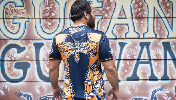 Robbie Abel models the Brumbies' new indigenous warm up jersey