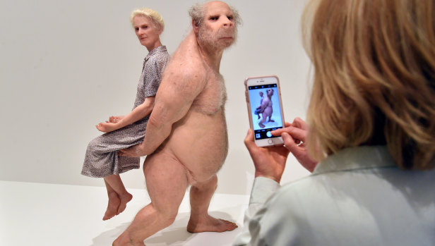The exhibition shows the evolution of a human woman and human-pig hybrid man.