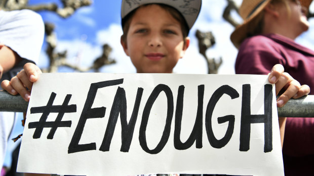Zachary Chakin holds up a sign as crowds of people participate in the March for Our Lives rally in support of gun control on  Saturday in San Francisco. 