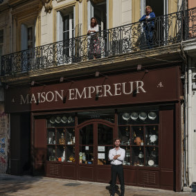The apartment, with balcony, is above the shopfront.