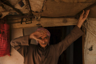 Abdelmeneim Moustafa, 54, in front of the temporary shelter he calls home in Saideh camp.
