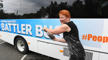 Pauline Hanson christens the bus.