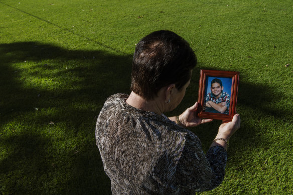 "Carol", the mother of Mohammed Noor Masri, with a picture of him as a child.