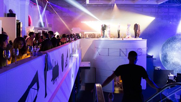 People attend the MAAS Fashion Ball at the Powerhouse Museum in February.