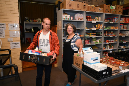 Andrea Norwood and Josh Palmer pick up food relief and supplies in Bayswater.