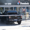 Man fights off kidnapper, crashes ute into Sydney pizza shop, in suspected gang attack