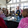 Eastwood CWA President Margery East serves Devonshire tea at the volunteer-run tea room.