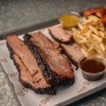 Plate 2 with beef brisket, pork belly and fries and hot wings.