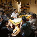 Head chef Yusuke Morita at work preparing sushi with his wife Izumi.