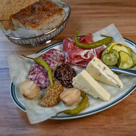 Brewers board with prosciutto, saucisson, cheddar, blue, xpa mustard, pickles, chutney and lavosh.