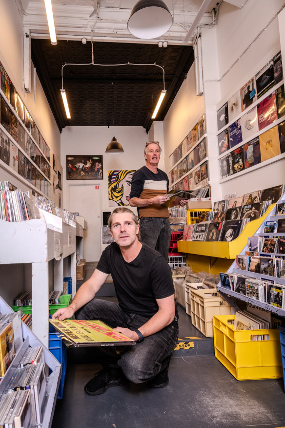 Leigh Carmichael (left) with Music Without Frontiers manager Mel Stewart in the Hobart record store. Carmichael made a vow to do everything he could to help save it.