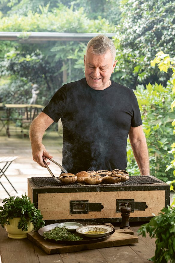 Jimmy cooks mushrooms on his hibachi. 