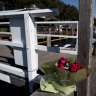Flowers have been left at Church Point Wharf after a woman died in a boating accident in nearby Elvina Bay on Sunday night.