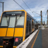 A Tangara train pulls out of Milsons Point station on a journey across Sydney Harbour Bridge on Tuesday.