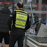 A security guard confronts a man for stealing at Coles Prahran.