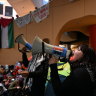 A group of students occupy the Arts West building at Melbourne University’s Parkville campus on Wednesday. 