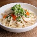 Mentaiko udon with cod roe, shimeji mushrooms and cream.