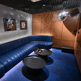 The private karaoke rooms are each decked out with disco balls.