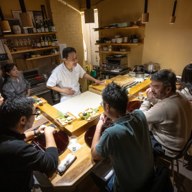 Head chef Yusuke Morita preparing sushi with his wife Izumi.