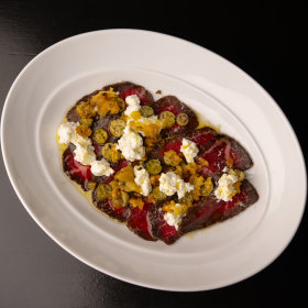Blackmore Wagyu basturma with pickled cucamelons and ricotta.