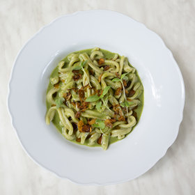 Casarecce pasta with pesto and roasted tomato.